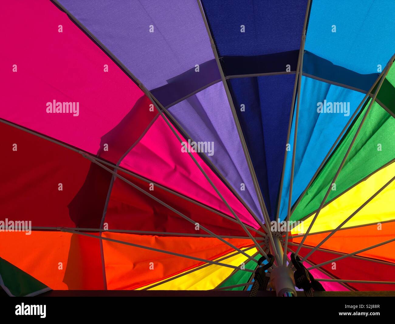 Rainbow beach umbrella closeup detail Stock Photo Alamy