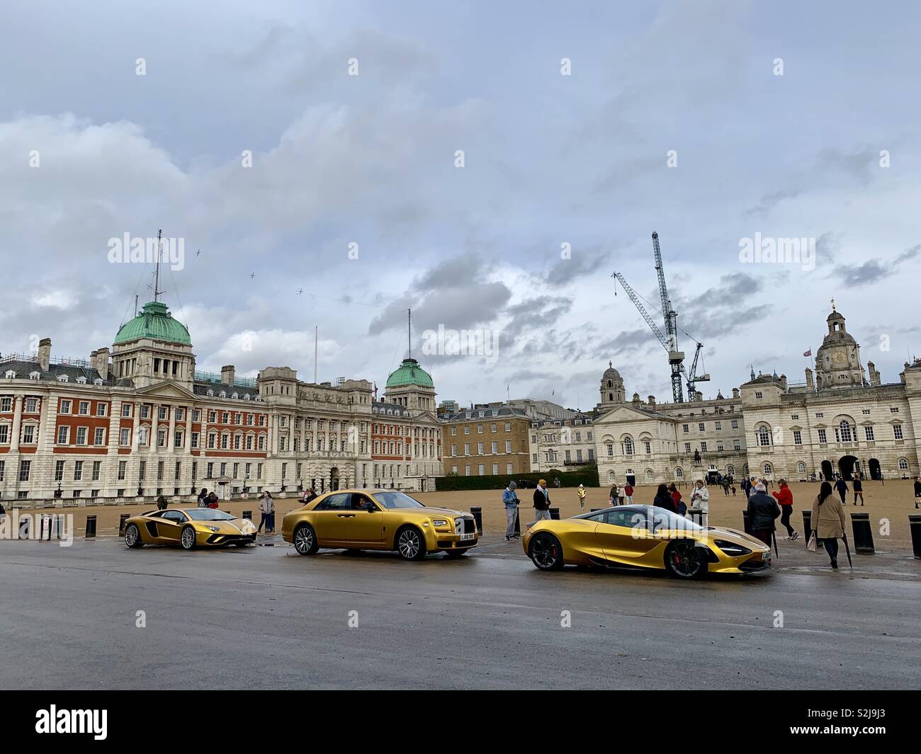 Golden Supercars attracting attention at Horse Guards Parade, London, UK. March 2019. - Smartphone Captured Stock Image
