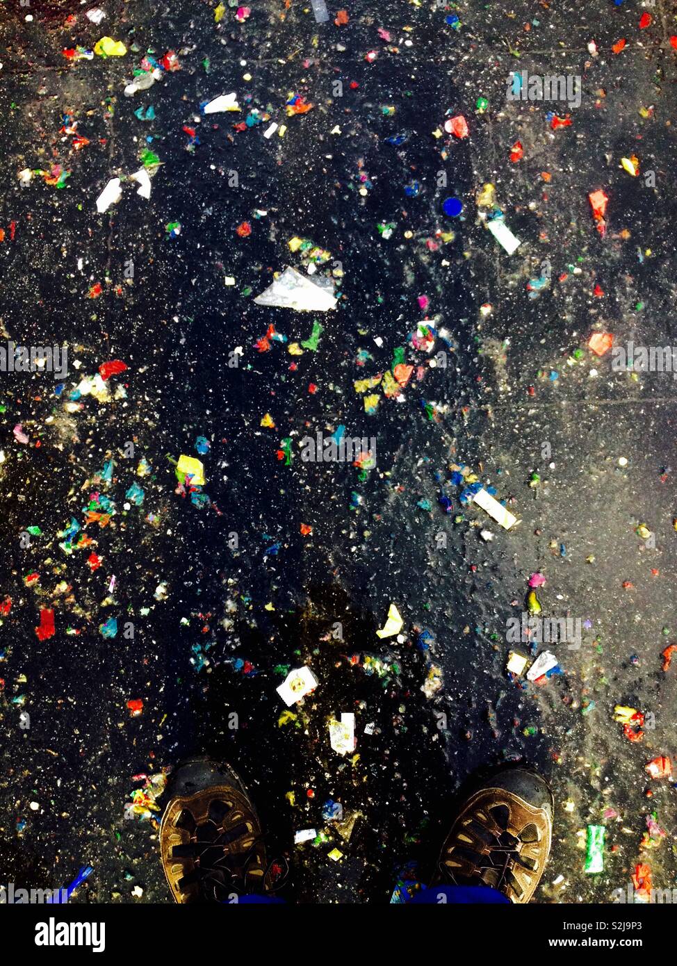 Dirty and wet ground Full of confetti - Smartphone Captured Stock Image