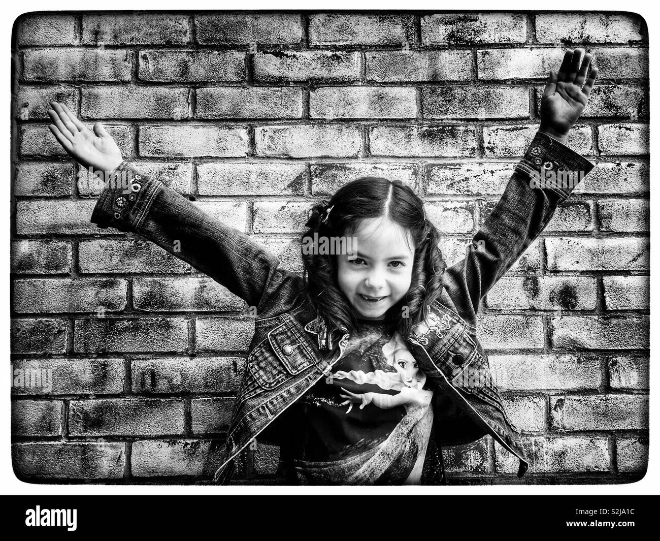 Girl wearing denim jacket Stock Photo Alamy