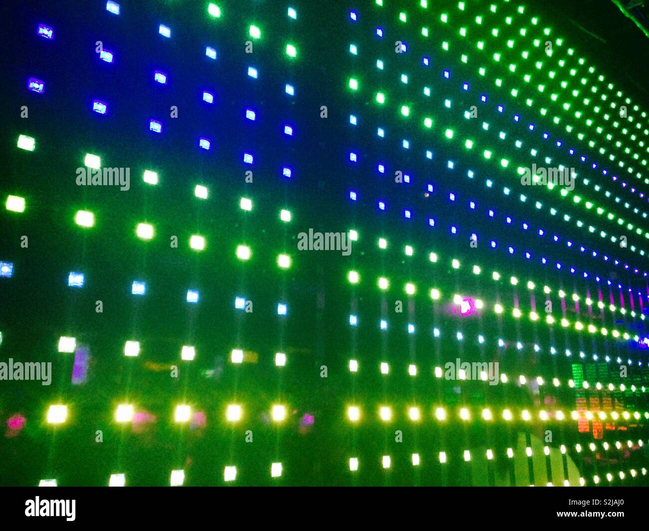 Colourful and bright lights and lighting pattern in the nightclub on board the Norwegian cruise lines ship the Breakaway - Smartphone Captured Stock Image