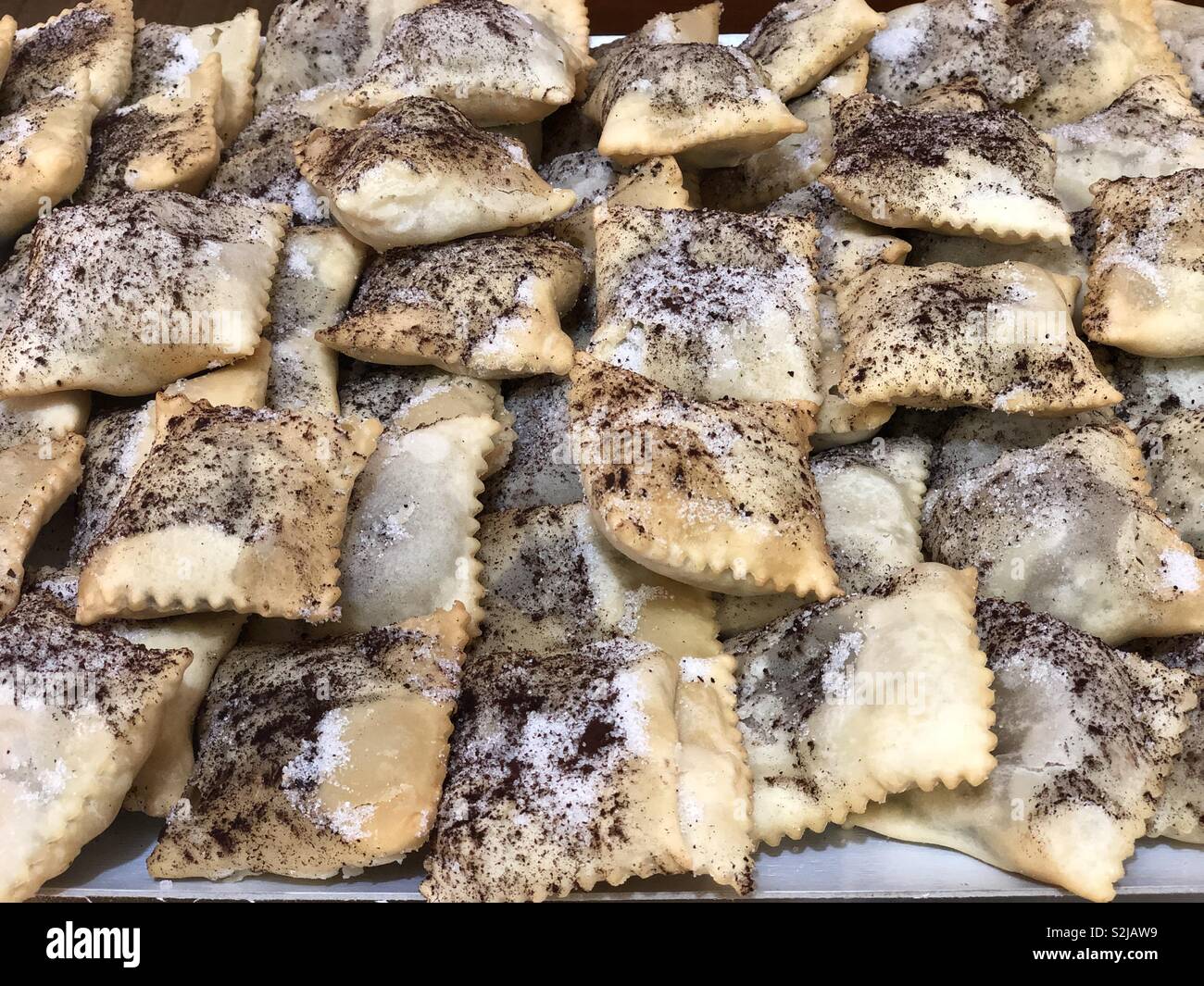 Ravioli filled with chicolate cream, typical italian carnival pastry - Smartphone Captured Stock Image