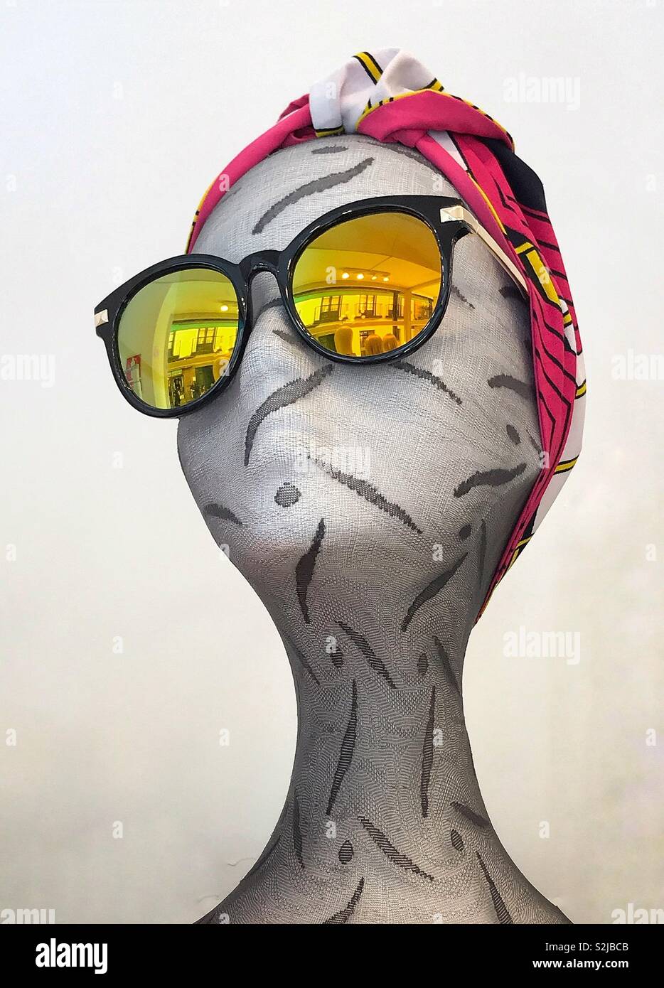 Mannequin head of female to display mirror coated sunglasses Stock Photo