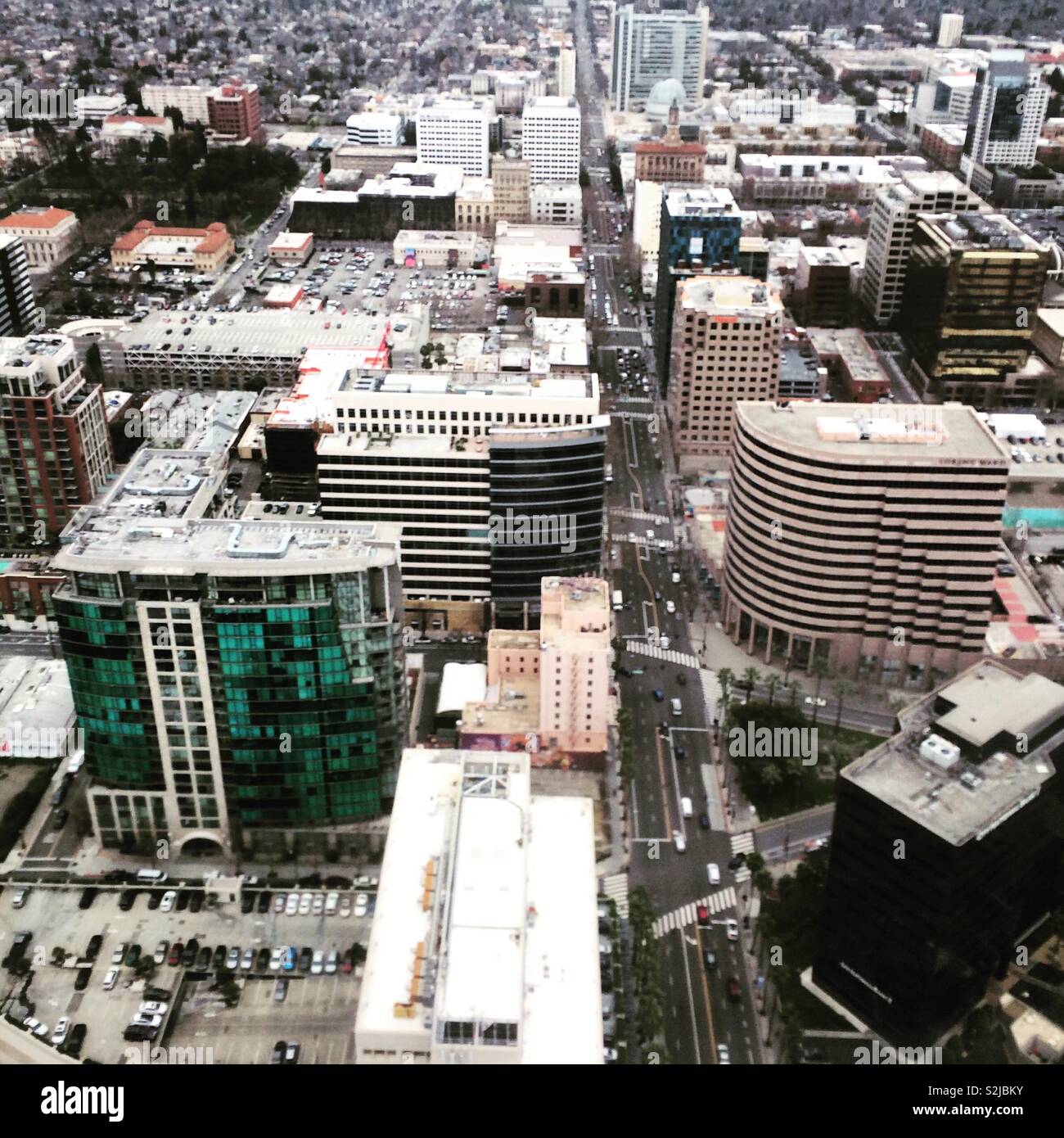 Buildings seen from an airplane window while descending towards San Jose, California, United States - Smartphone Captured Stock Image