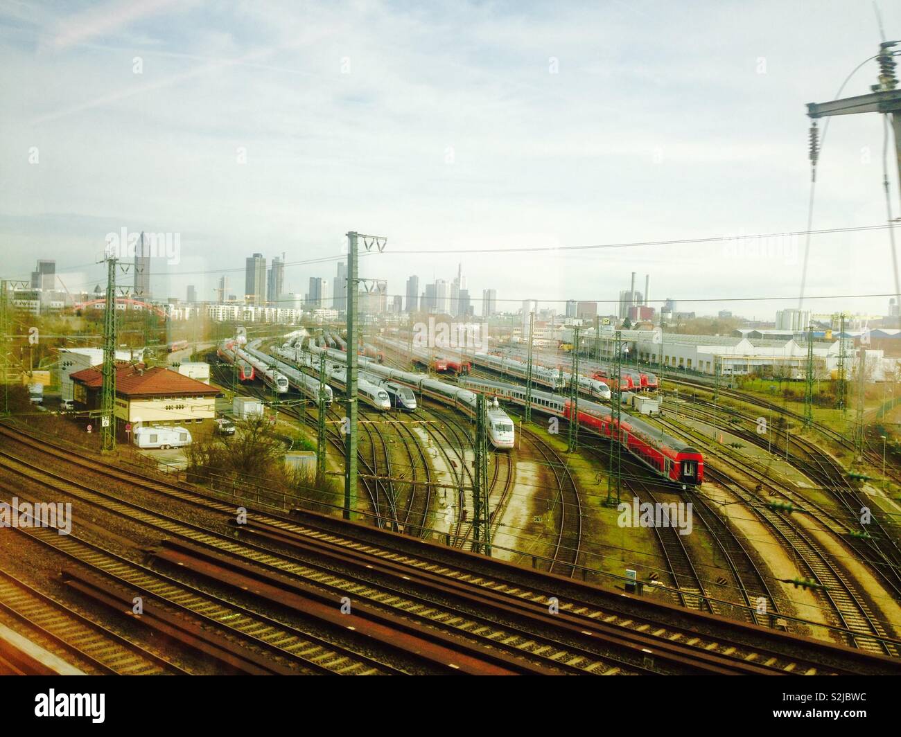Frankfurt am Main. Trains in the Hauptbahnhof with Mainhattan in the back - Smartphone Captured Stock Image