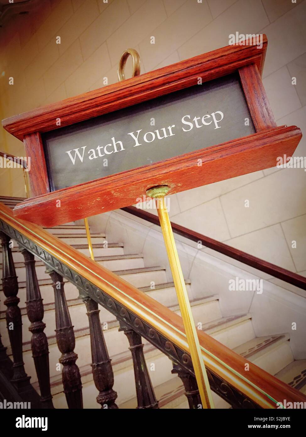 Watch your step warning sign on a flight of stairs, United States Stock Photo