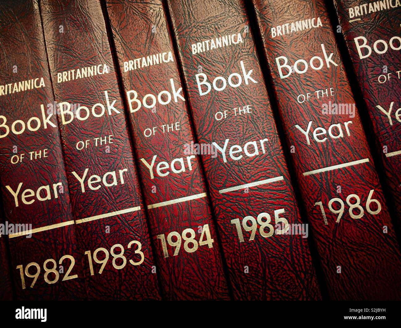 Books of the year 1982 through 1986 of the Encyclopaedia Britannica in the New York City public library, USA - Smartphone Captured Stock Image