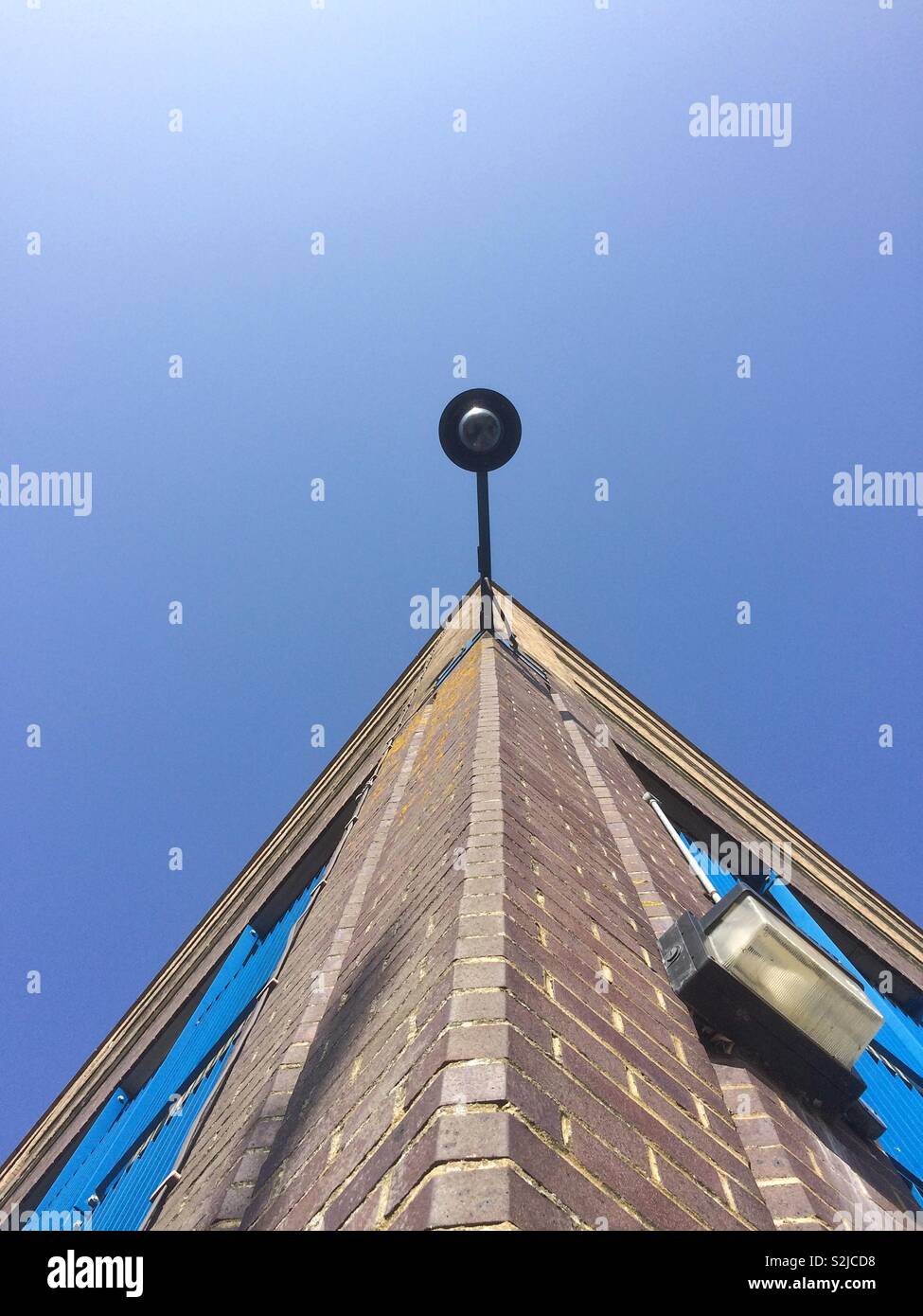 Public camera surveillance on building - Smartphone Captured Stock Image