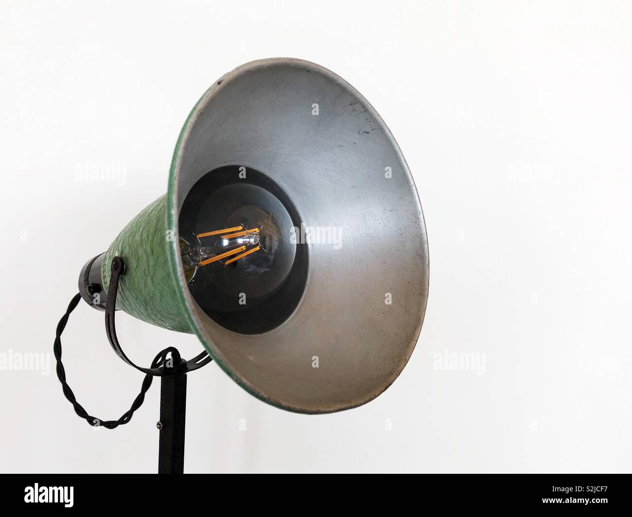 Retro desk lamp against white wall - Smartphone Captured Stock Image