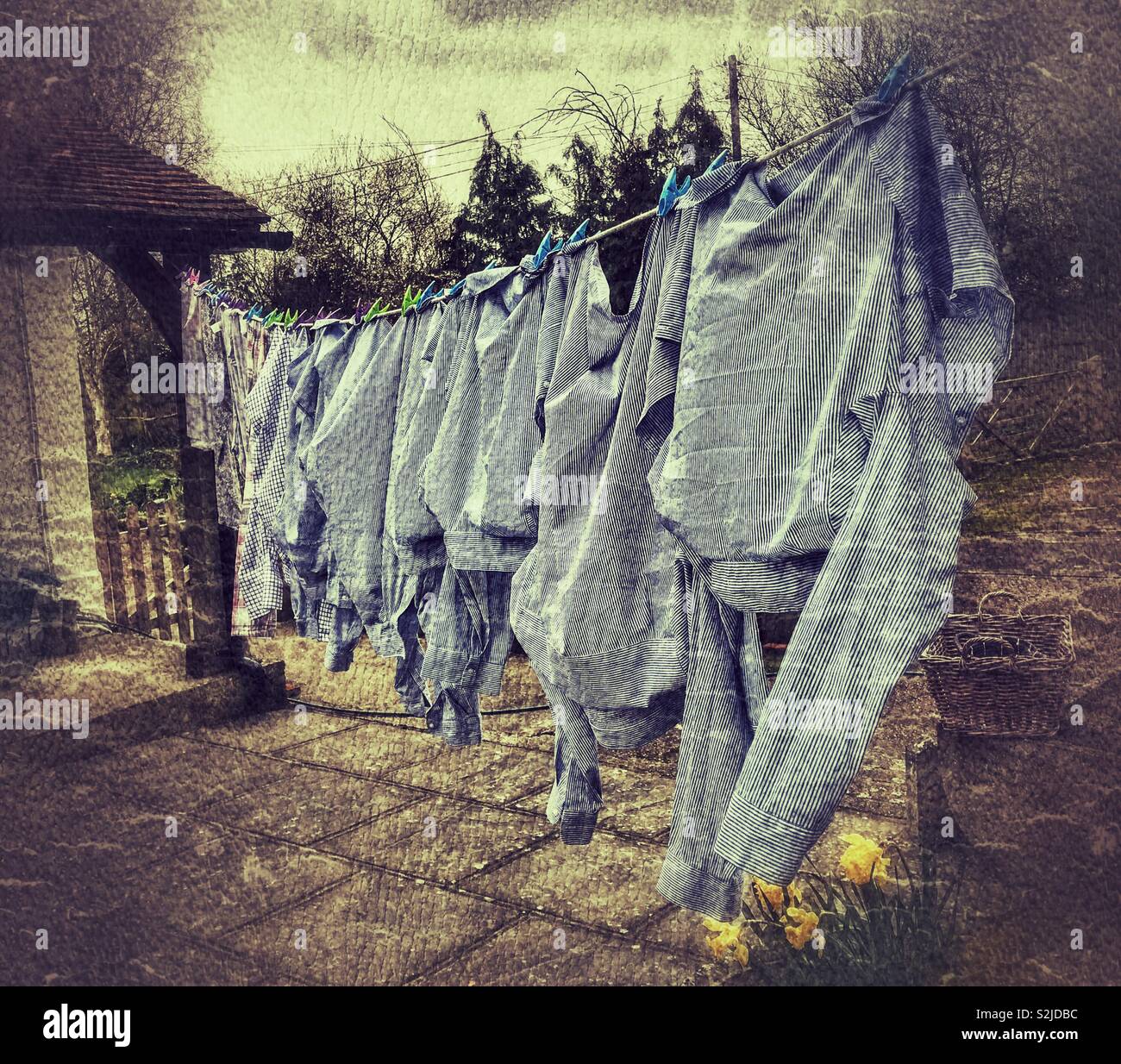 Washing hanging out to dry in colour with grunge filter. March 2019. - Smartphone Captured Stock Image