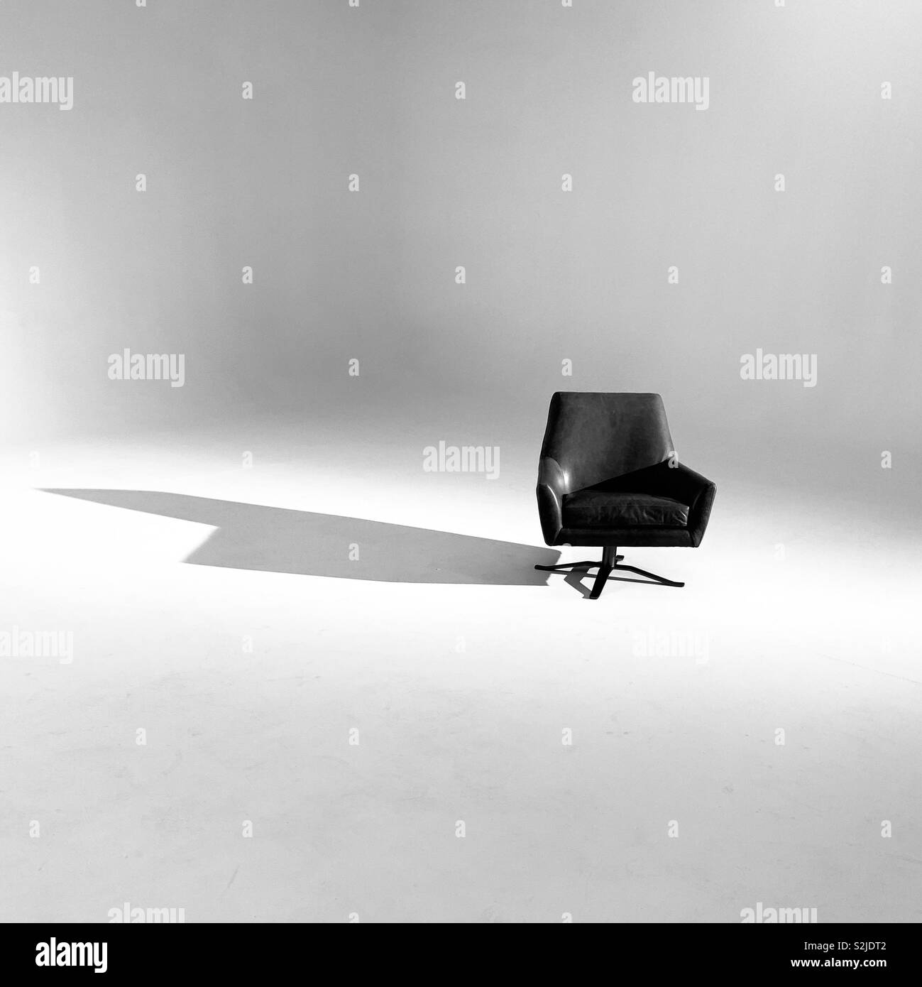 A chair in a white room. - Smartphone Captured Stock Image