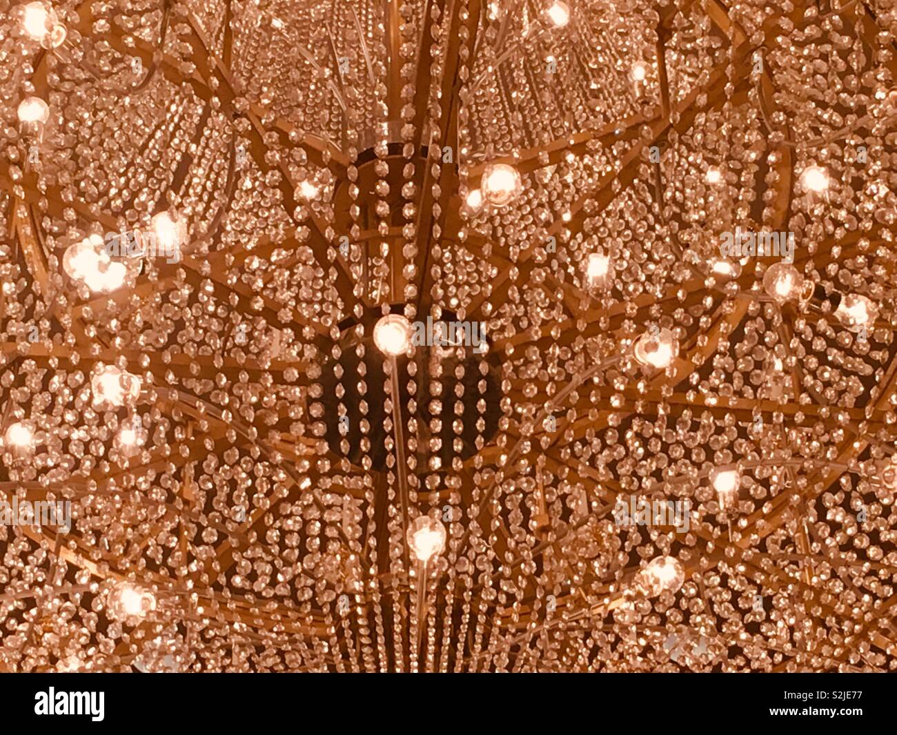 Closeup of a huge lit chandelier with all sorts of sparkling lights Stock  Photo - Alamy