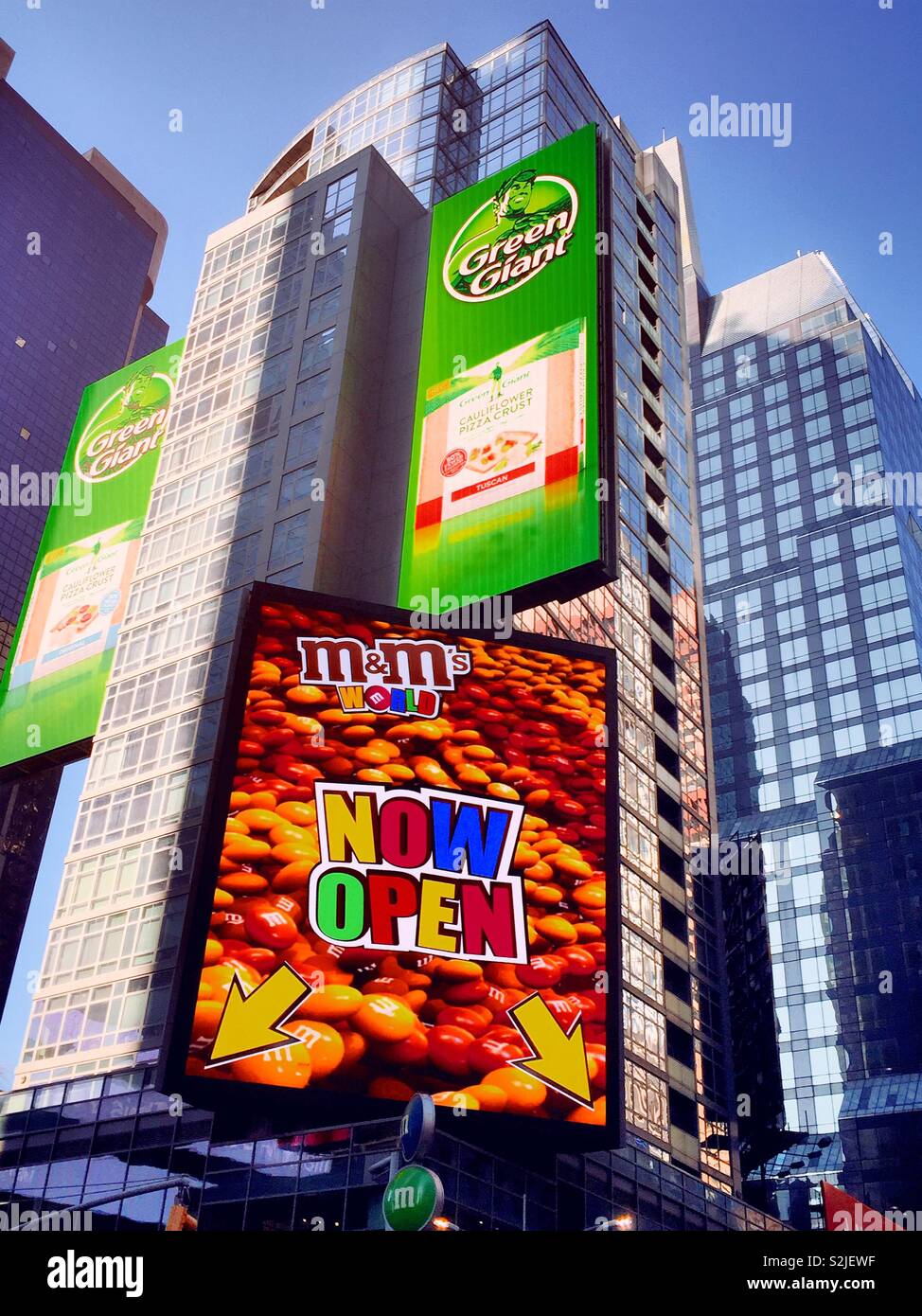 Vibrant large electronic billboards in Times Square, NYC, USA - Smartphone Captured Stock Image