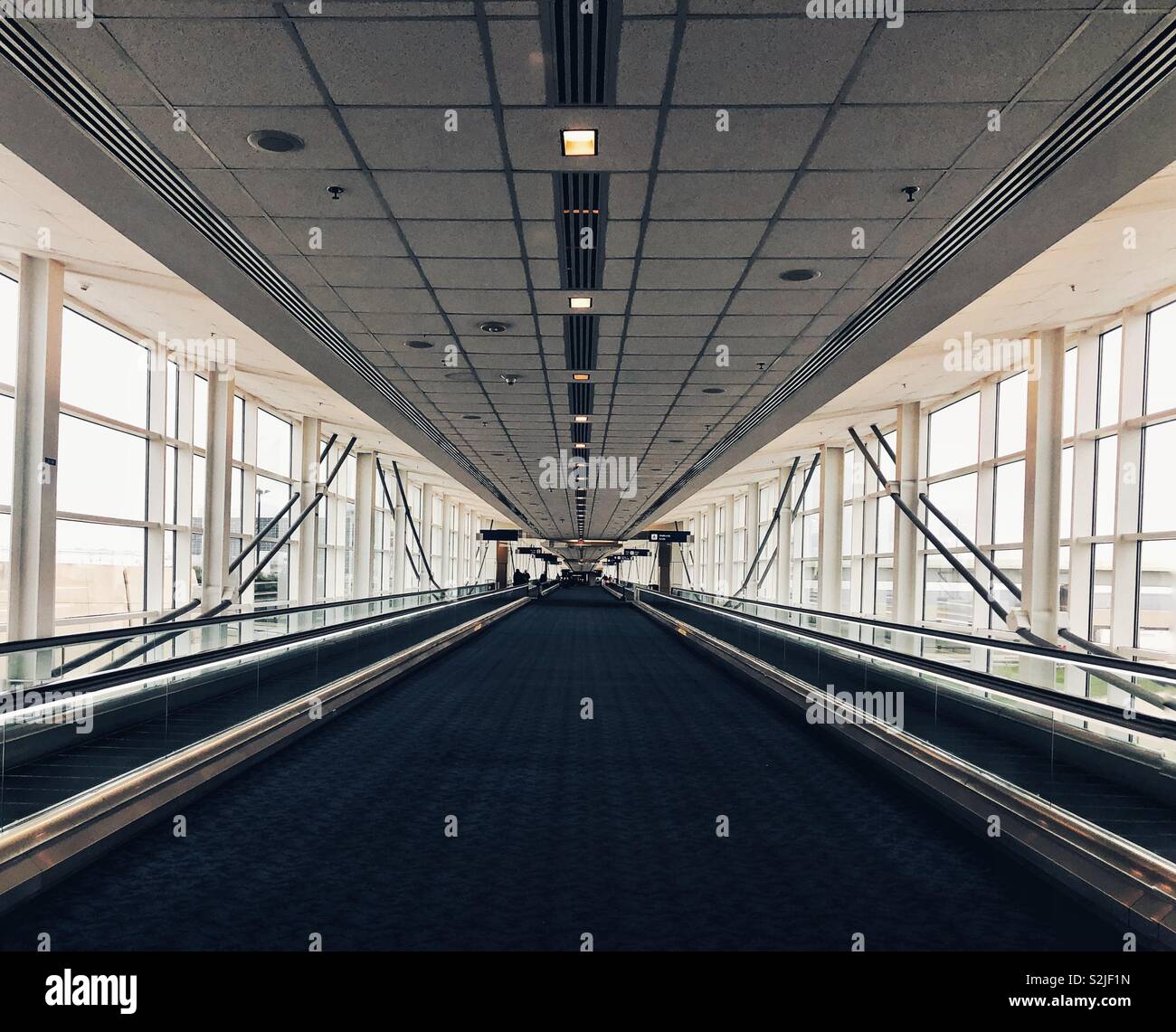 endless airport walkways Stock Photo