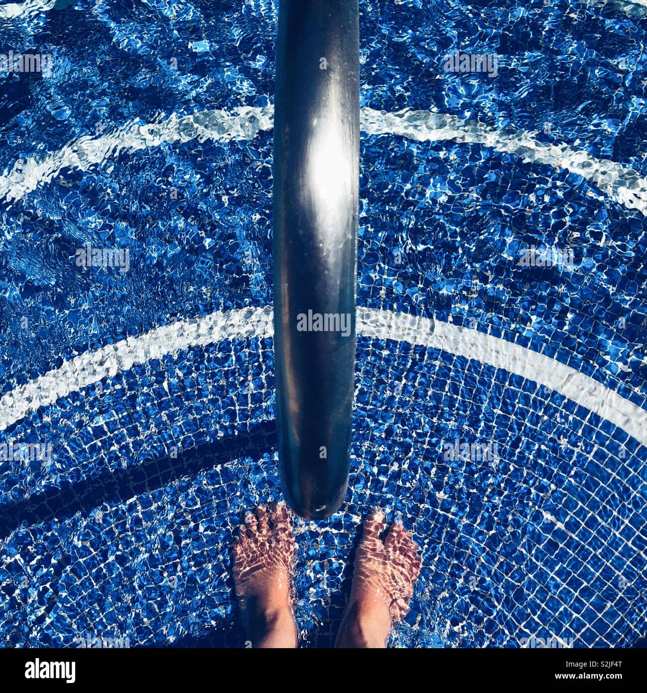 Standing on the pool steps - Smartphone Captured Stock Image Standing on the pool steps - Smartphone Captured Stock Image