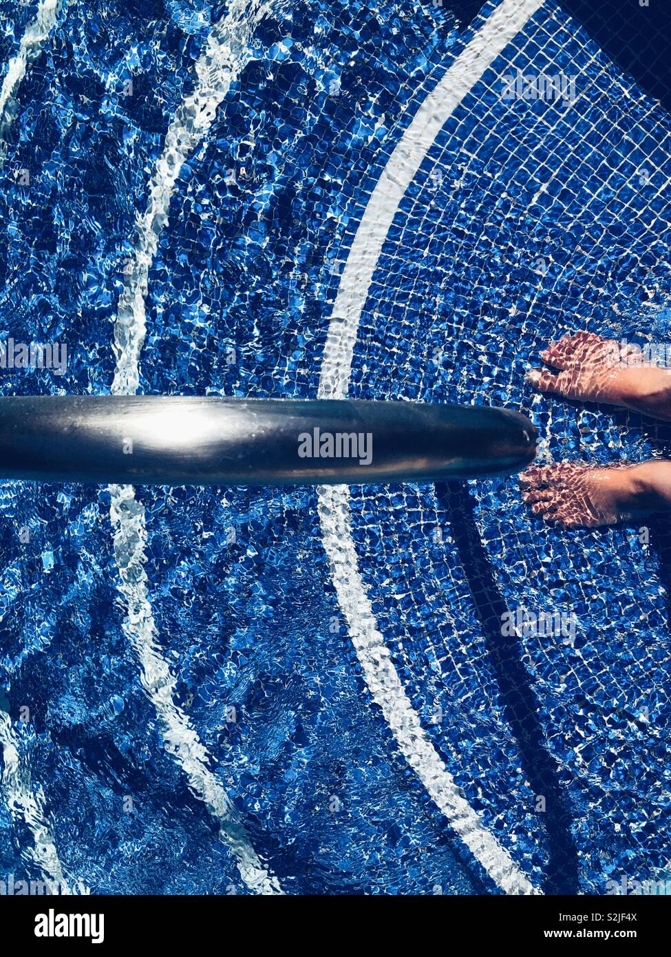 Standing on the pool steps - Smartphone Captured Stock Image Standing on the pool steps - Smartphone Captured Stock Image