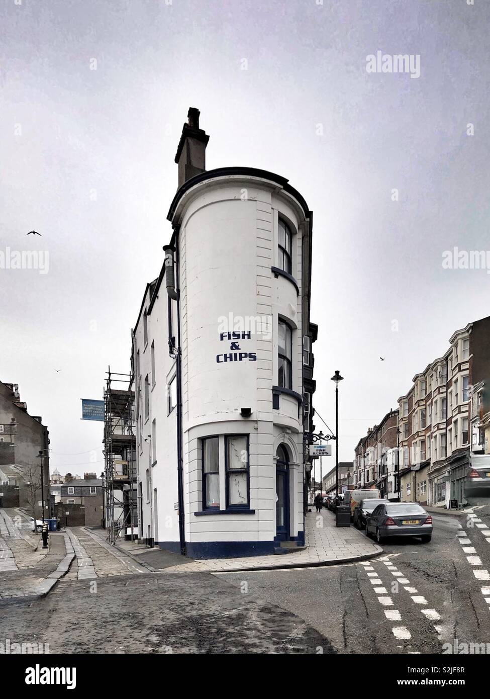 Flatiron-shaped building in use as a fish and chip shop, Scarborough, UK - Smartphone Captured Stock Image