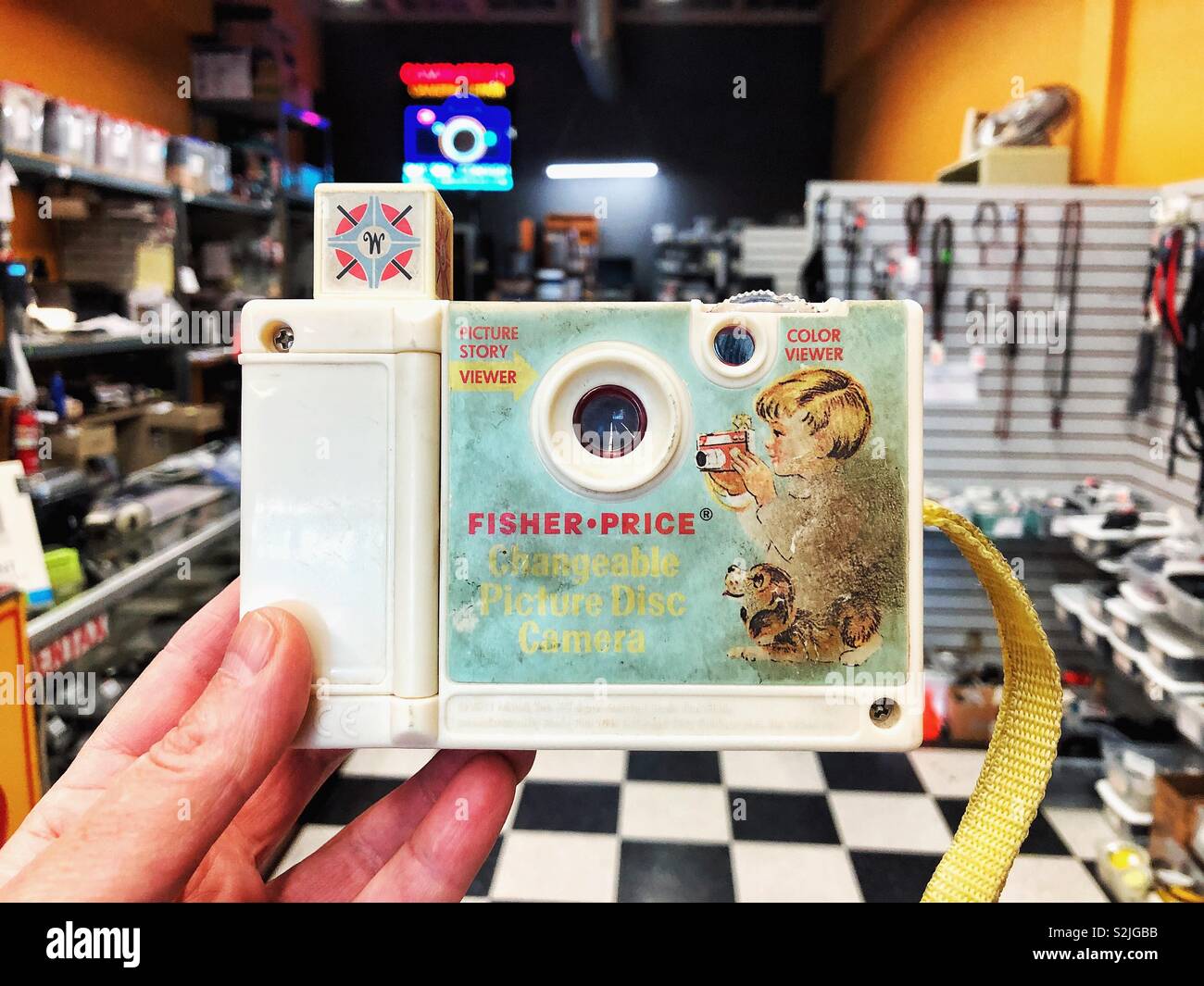 Vintage picture story viewer toy by Fisher Price in camera store in Seattle - Smartphone Captured Stock Image