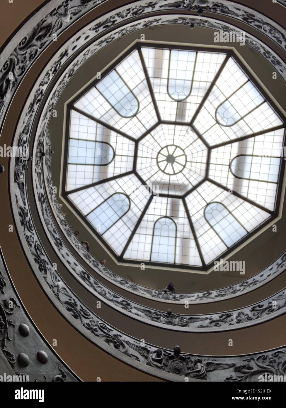 Looking up on the Bramante Staircase in the Vatican museum in the Vatican City. - Smartphone Captured Stock Image