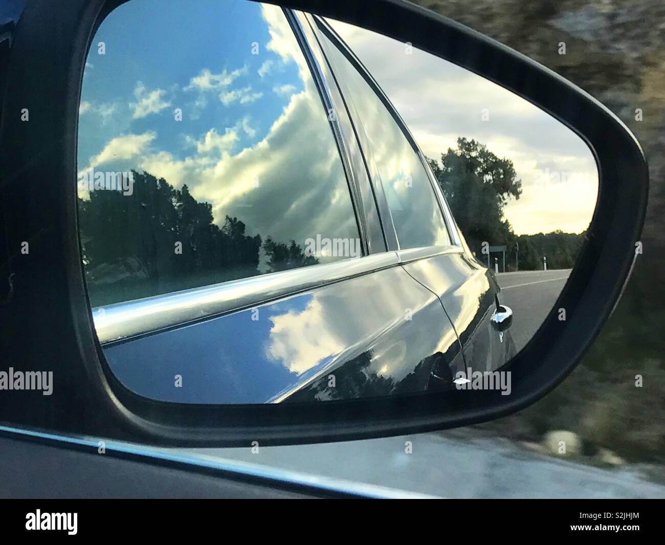 Reflection on rear view mirror - Smartphone Captured Stock Image