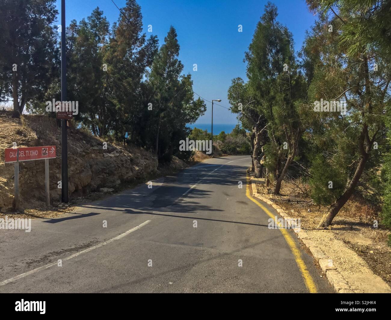 Rural road on a hot sunny day in Spain. Stock Photo