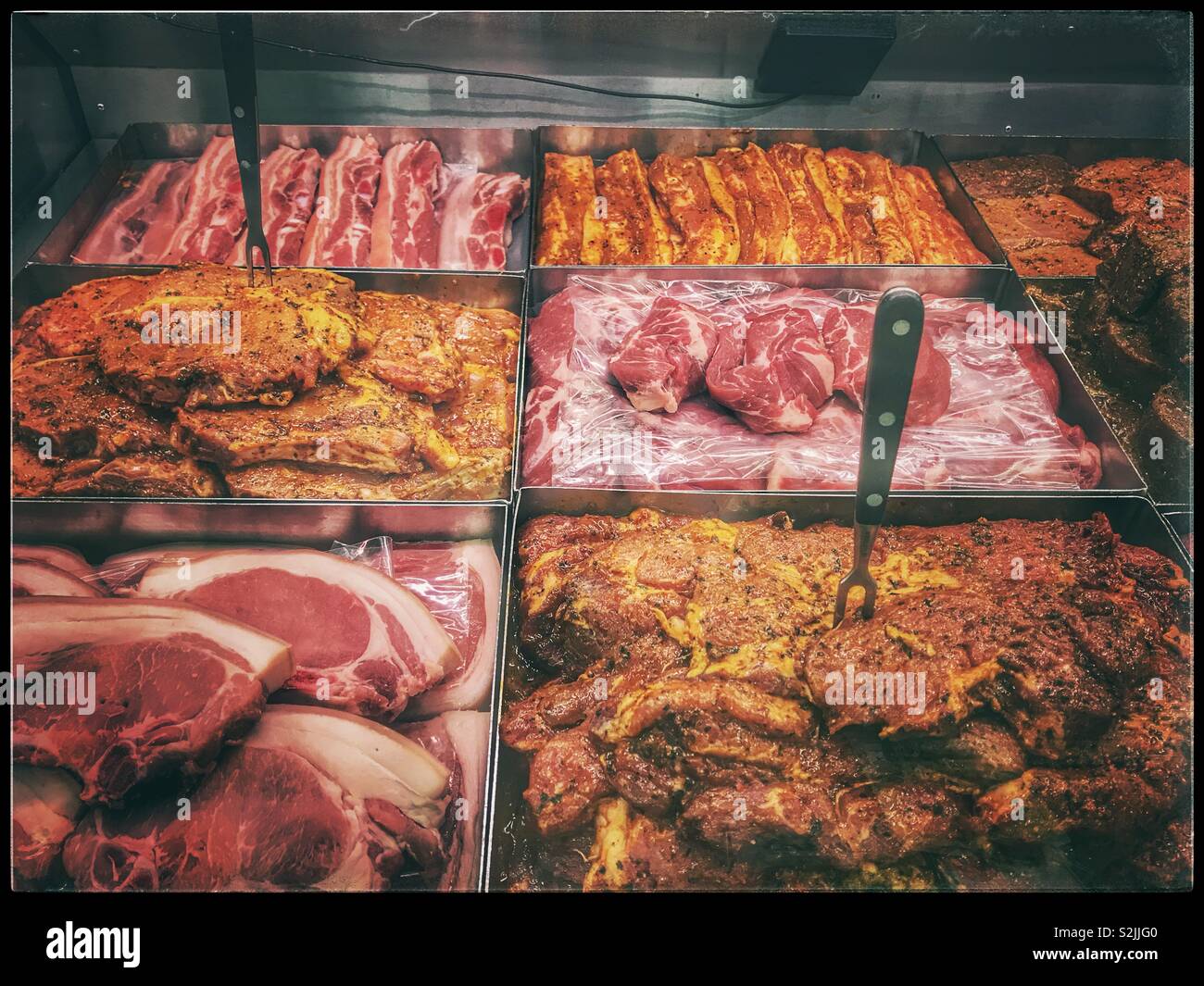 Fresh meat counter at deli. - Smartphone Captured Stock Image