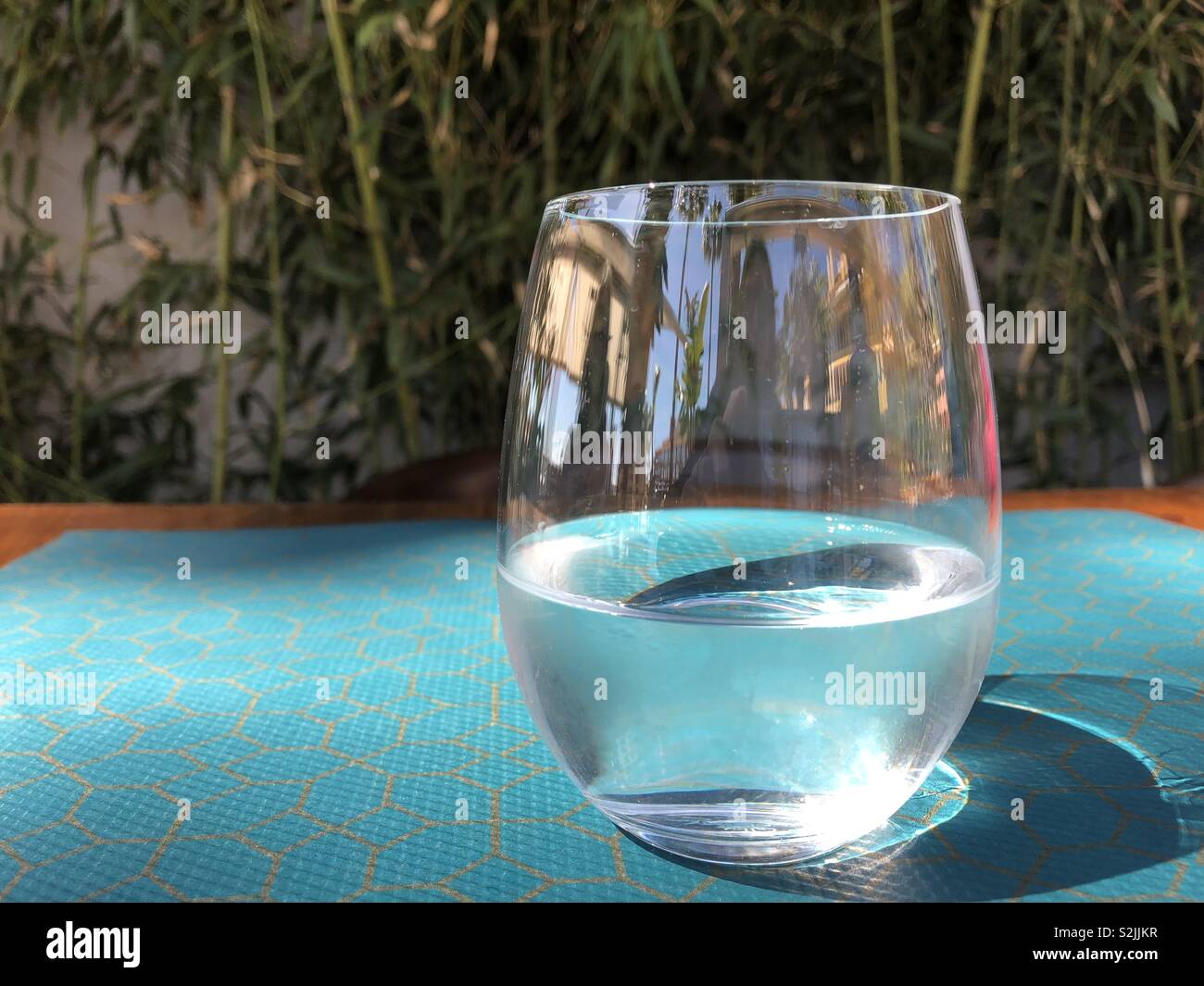Glass of water outdoors on table - Smartphone Captured Stock Image