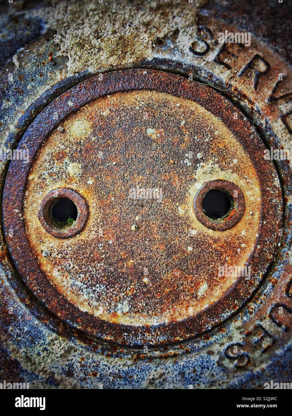 Faces in objects concept. Rusty sewer in Sabadell, Barcelona province, Catalonia Stock Photo