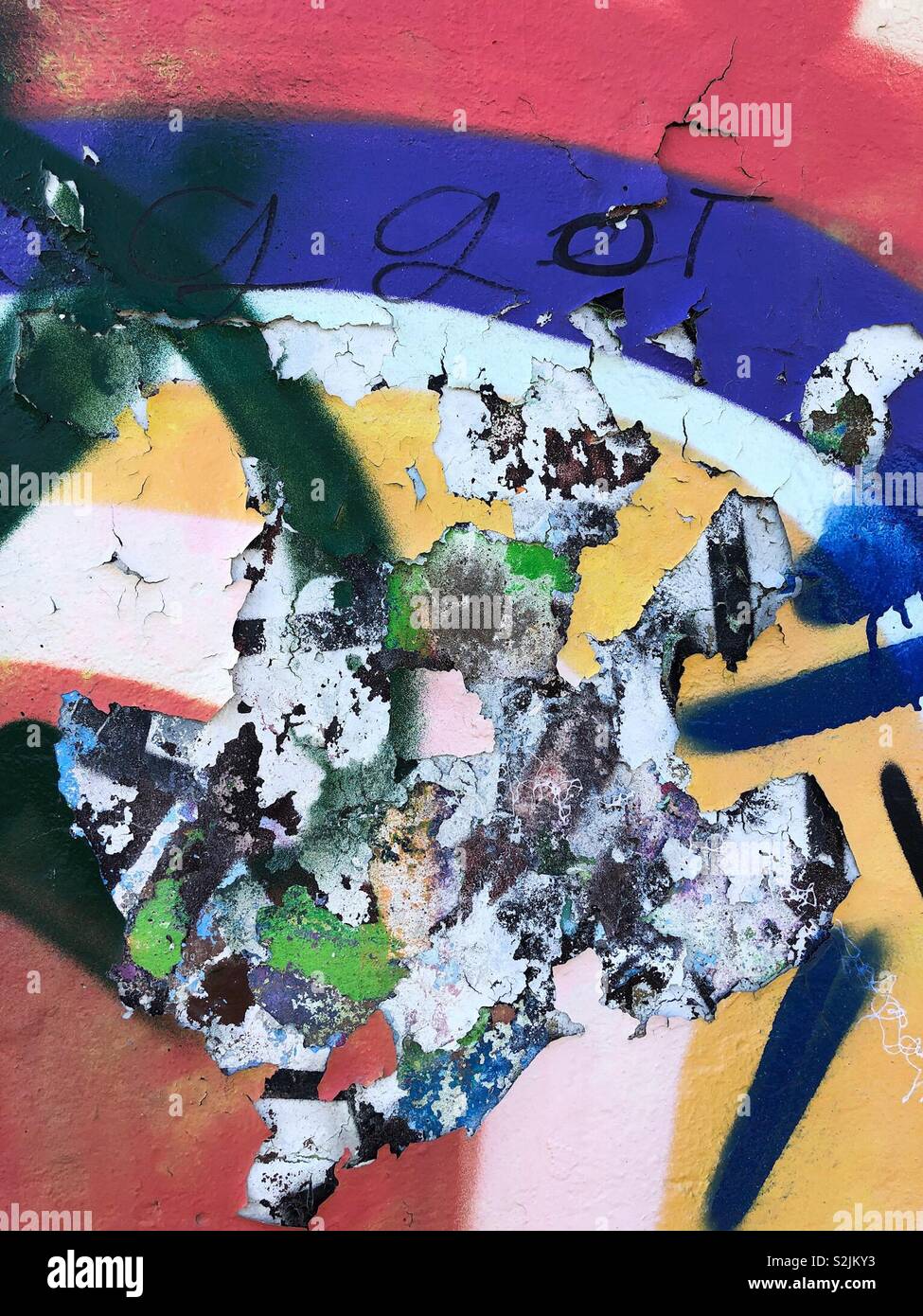 Abstract of multicoloured peeling paint on a concrete wall - Smartphone Captured Stock Image