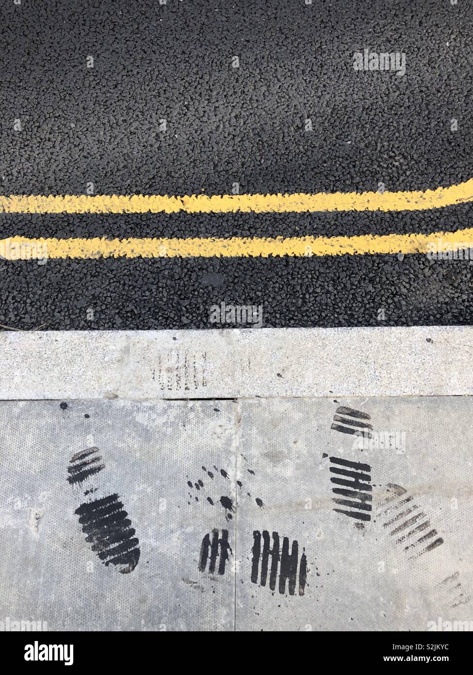 Newly laid out tarmac and footsteps - Smartphone Captured Stock Image