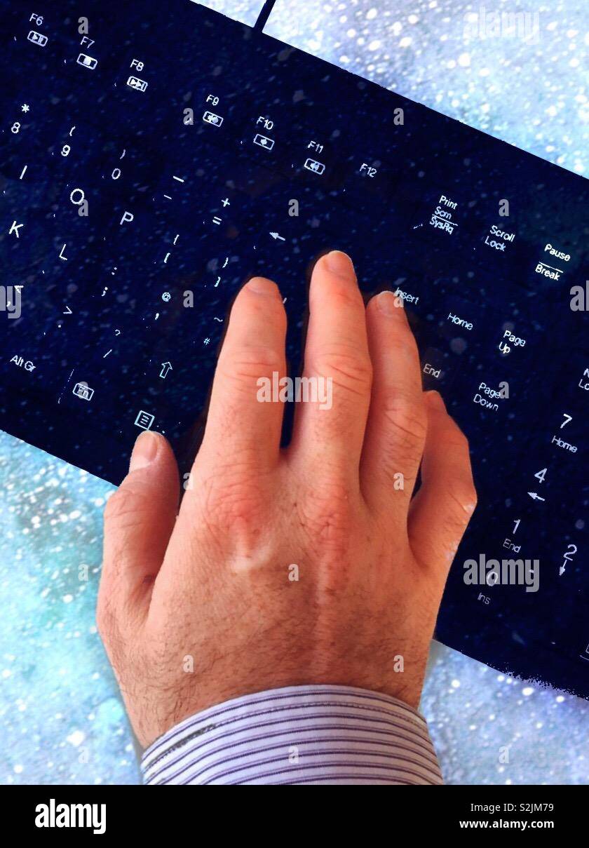 Cybercrime using the Internet with online safety.  Spying and using social media.  Responsible use of pc and computer.  Surfing and online banking.  Fingers typing.  Working from home - Smartphone Captured Stock Image