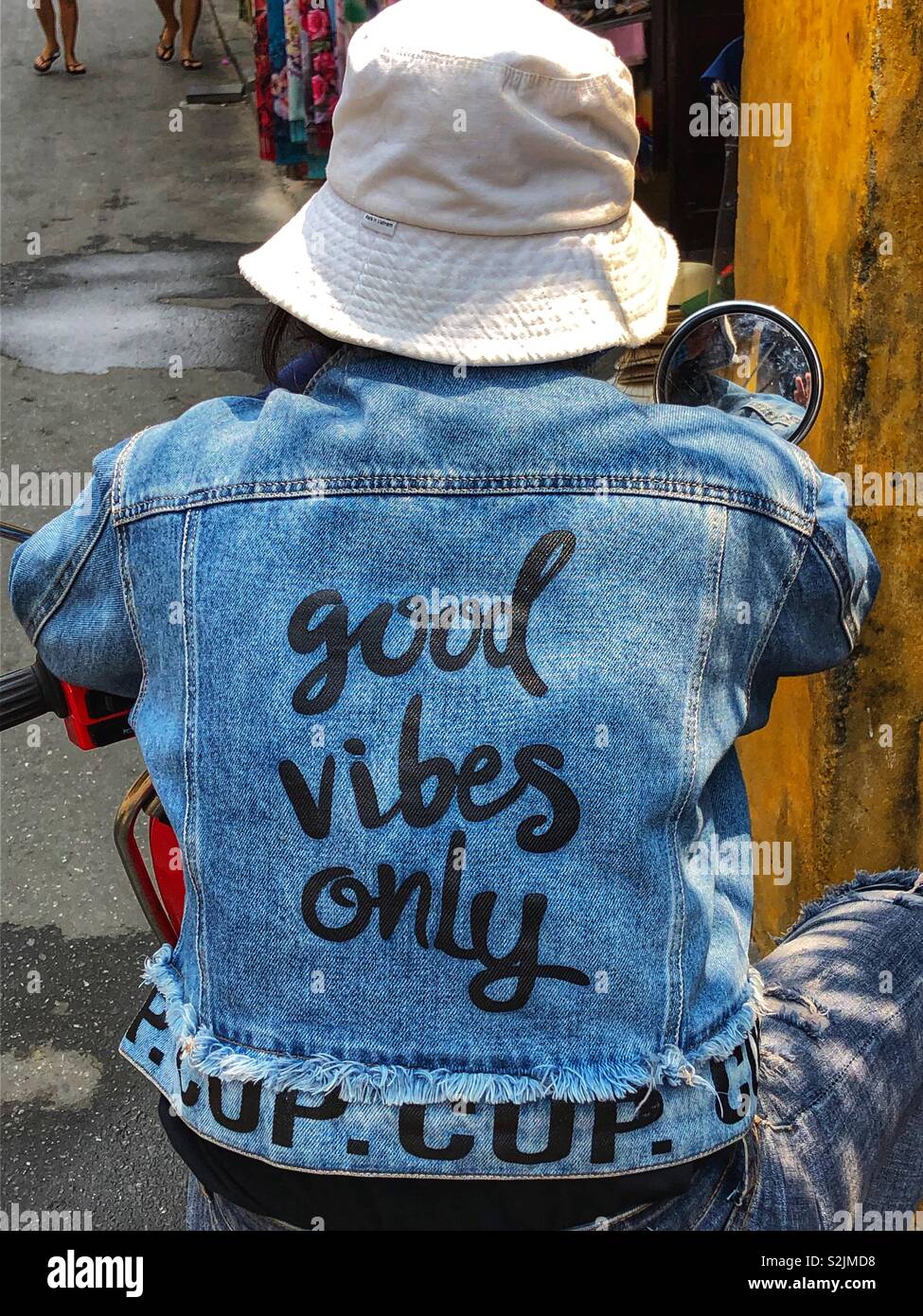 Good vibes only - motorcycle jeans jacket. Adia Stock Photo