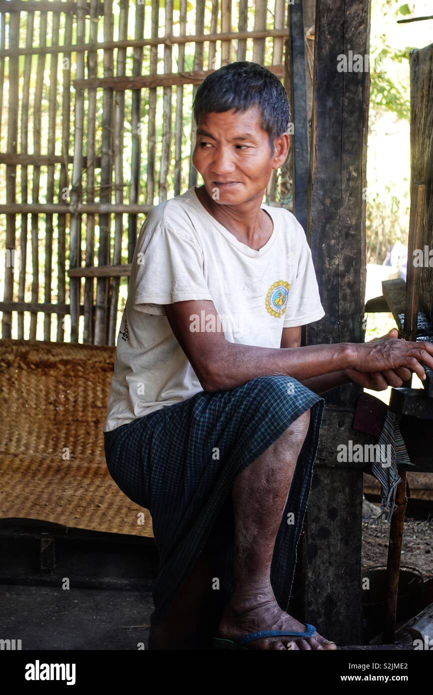 Portrait of a burmese man. A worker in a sugar factory in Myanmar