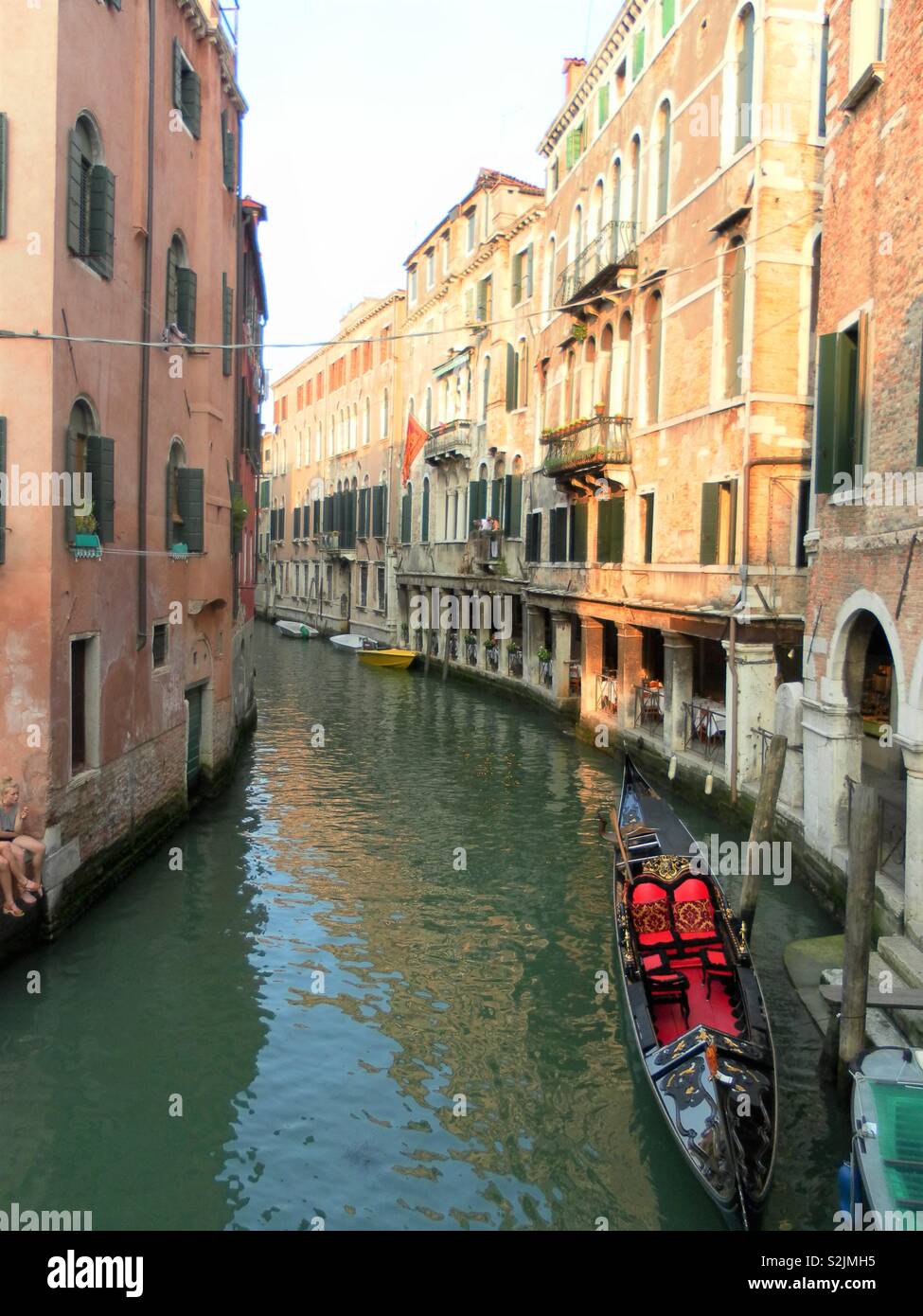 Venice canal with gondola Stock Photo Alamy