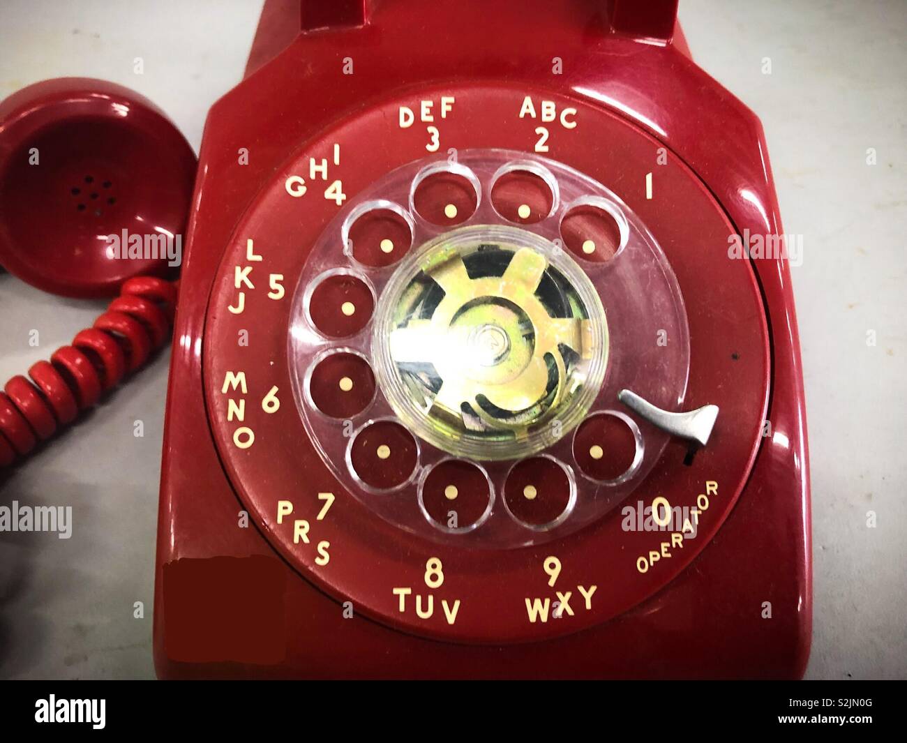 Old Red Rotary phone dial Stock Photo