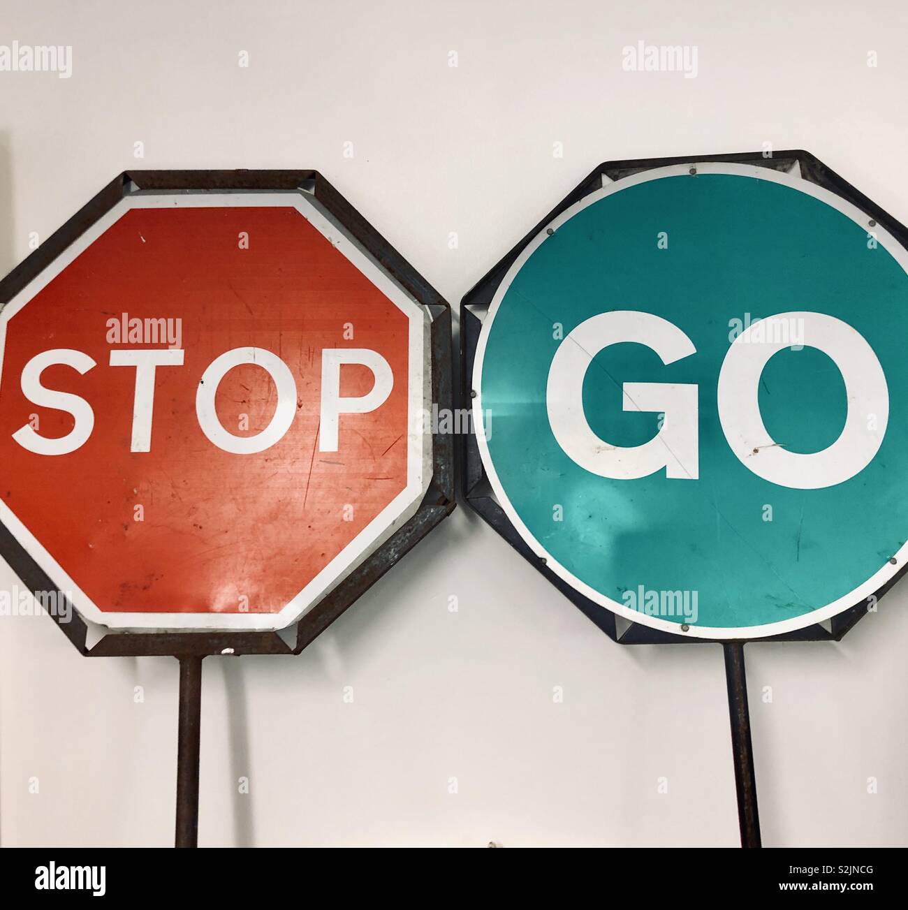 Stop go signs Stock Photo