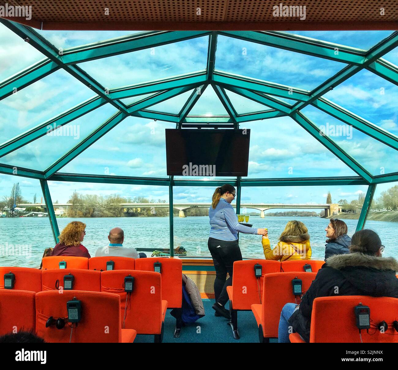 Tourists on a river cruise sightseeing boat on the River Danube in Budapest - Smartphone Captured Stock Image