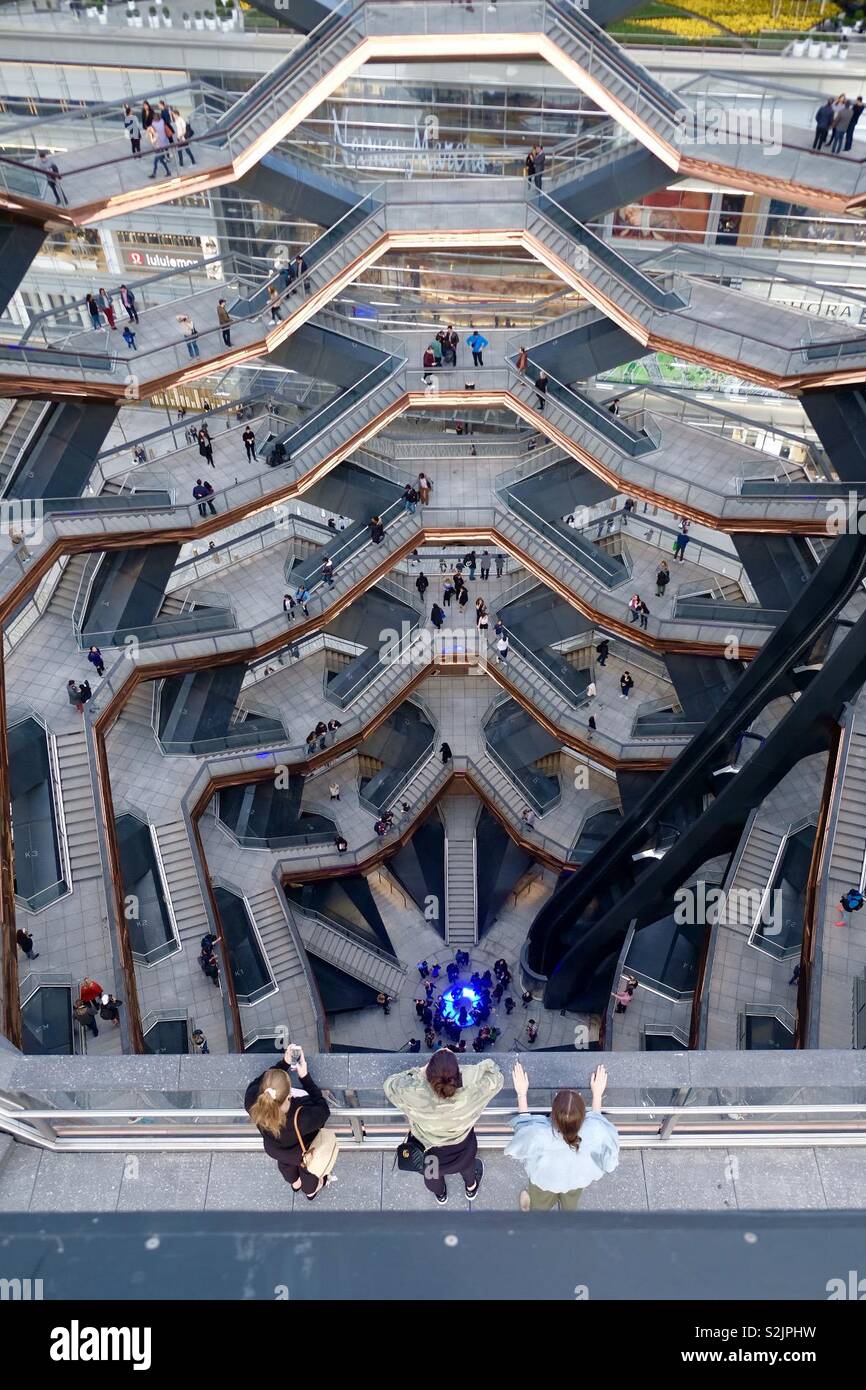 Visitors enjoying the view from above inside the Vessel at Hudson Yards in New York City Stock Photo