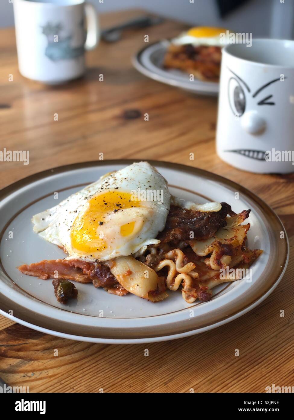 Egg on lasagna Stock Photo Alamy