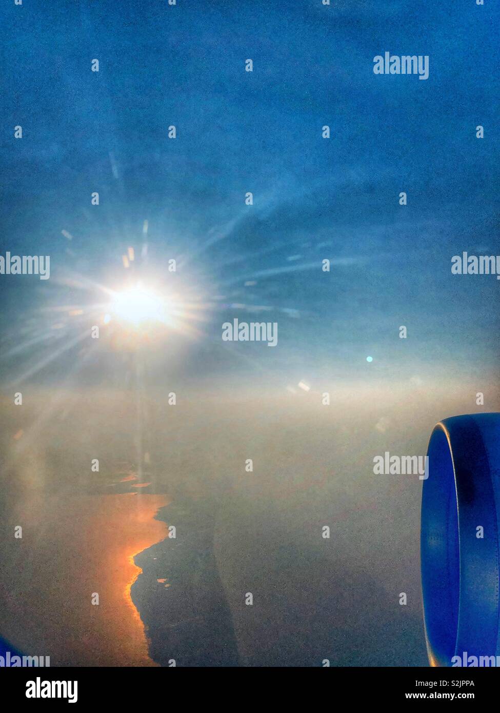 Flying into the bright sun. - Smartphone Captured Stock Image