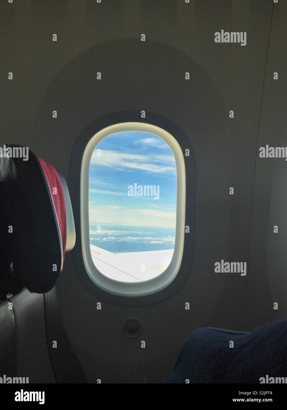 Sky view through an aéroplane window - Smartphone Captured Stock Image