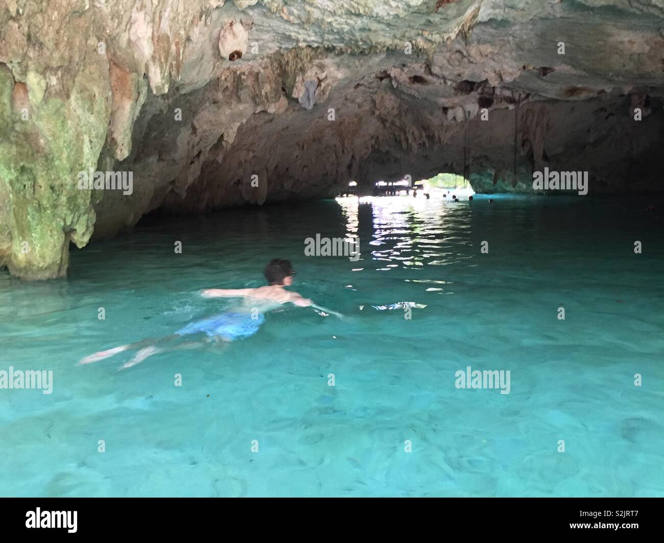 Man swimming through cave in cenote, tulum, Mexico Stock Photo - Alamy