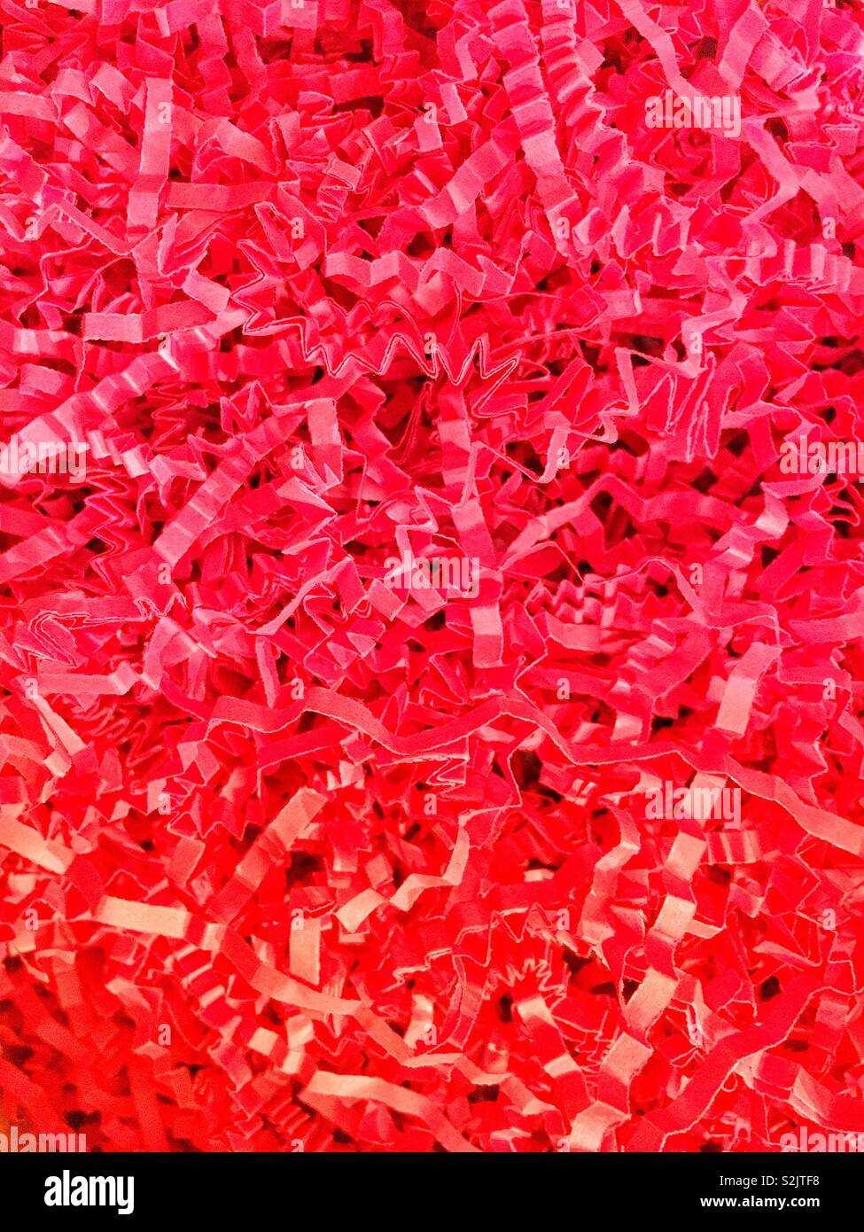 Tons of red paper string confetti filling up the frame. Stock Photo