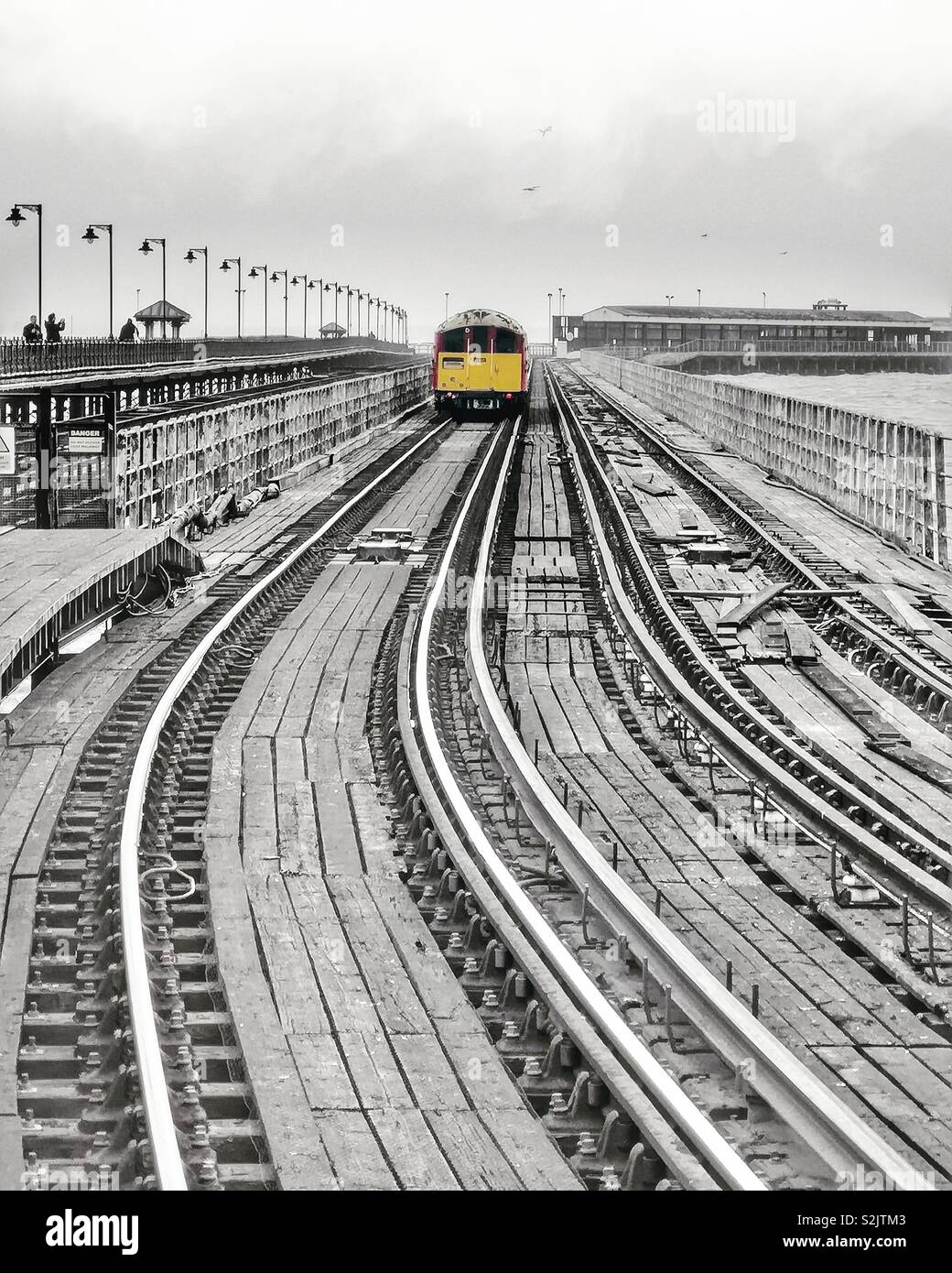 Vintage London Underground train crossing Ryde Pier, Isle of Wight - Smartphone Captured Stock Image