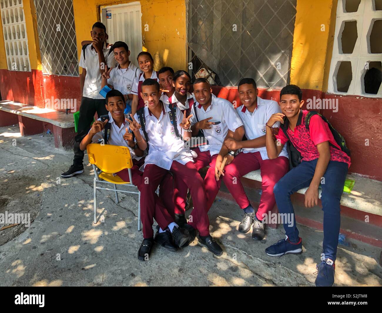 A group of smiling students in the courtyard of a school in Santa Marta, Colombia. - Smartphone Captured Stock Image