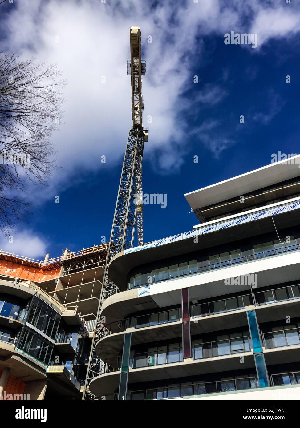 Tall crane at modern construction site - Smartphone Captured Stock Image