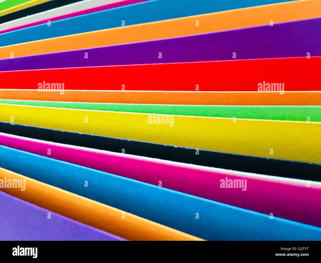 Abstract pattern of the edge of coloured card - Smartphone Captured Stock Image
