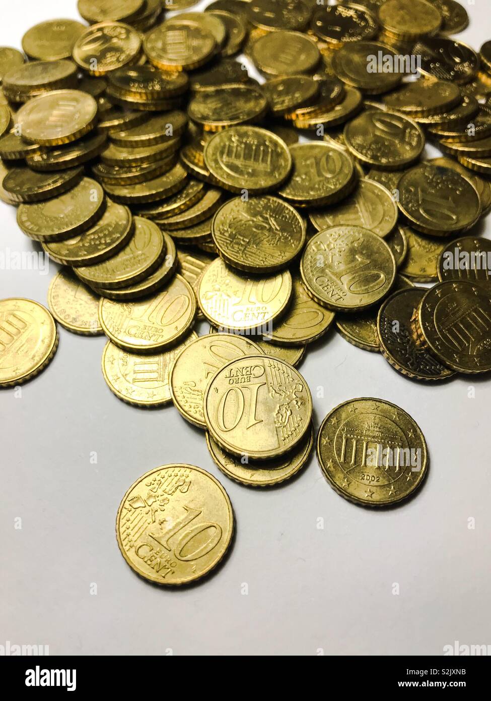 Pile of ten euro cent coins Stock Photo