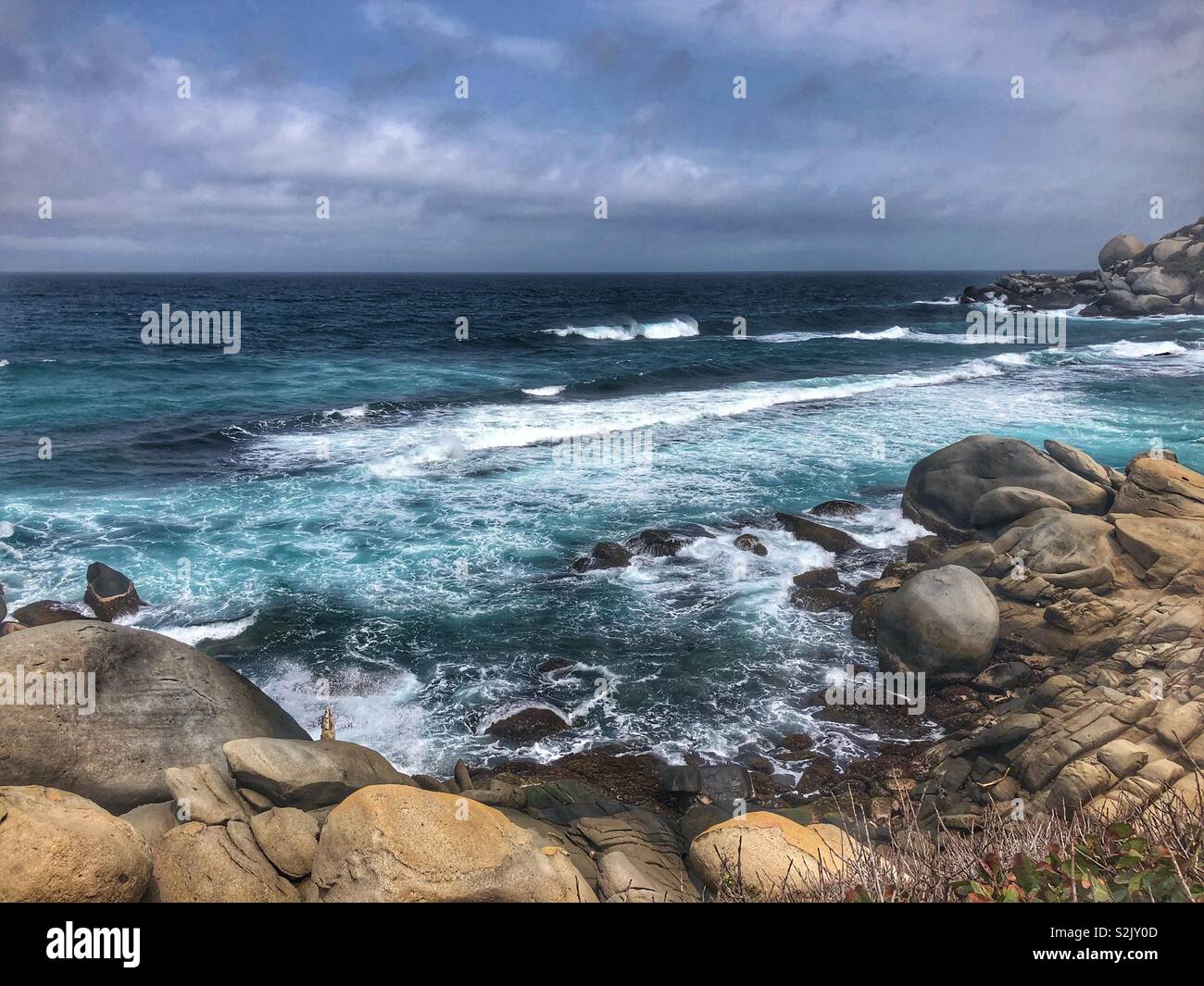 Rugged shoreline in Tayrona Park in Santa Marta, Colombia. - Smartphone Captured Stock Image Rugged shoreline in Tayrona Park in Santa Marta, Colombia. - Smartphone Captured Stock Image