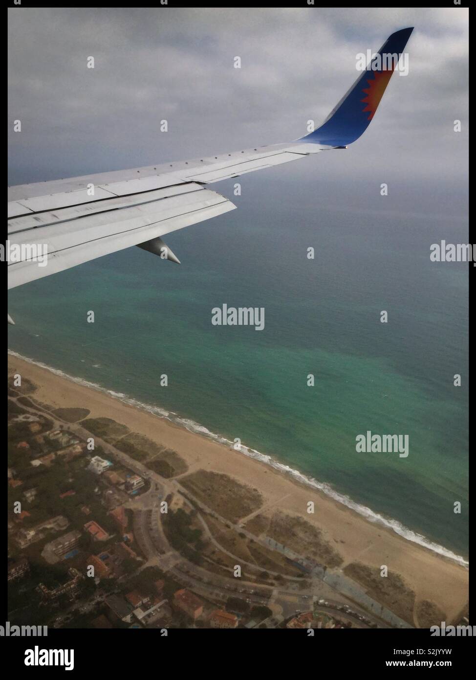 A view above the Mediterranean from seat 26F on a Jet2 aircraft en route from Leeds Bradford Airport (UK) to Barcelona El Prat, Spain. - Smartphone Captured Stock Image